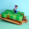 Minecraft®-figur på spelvärldstårta